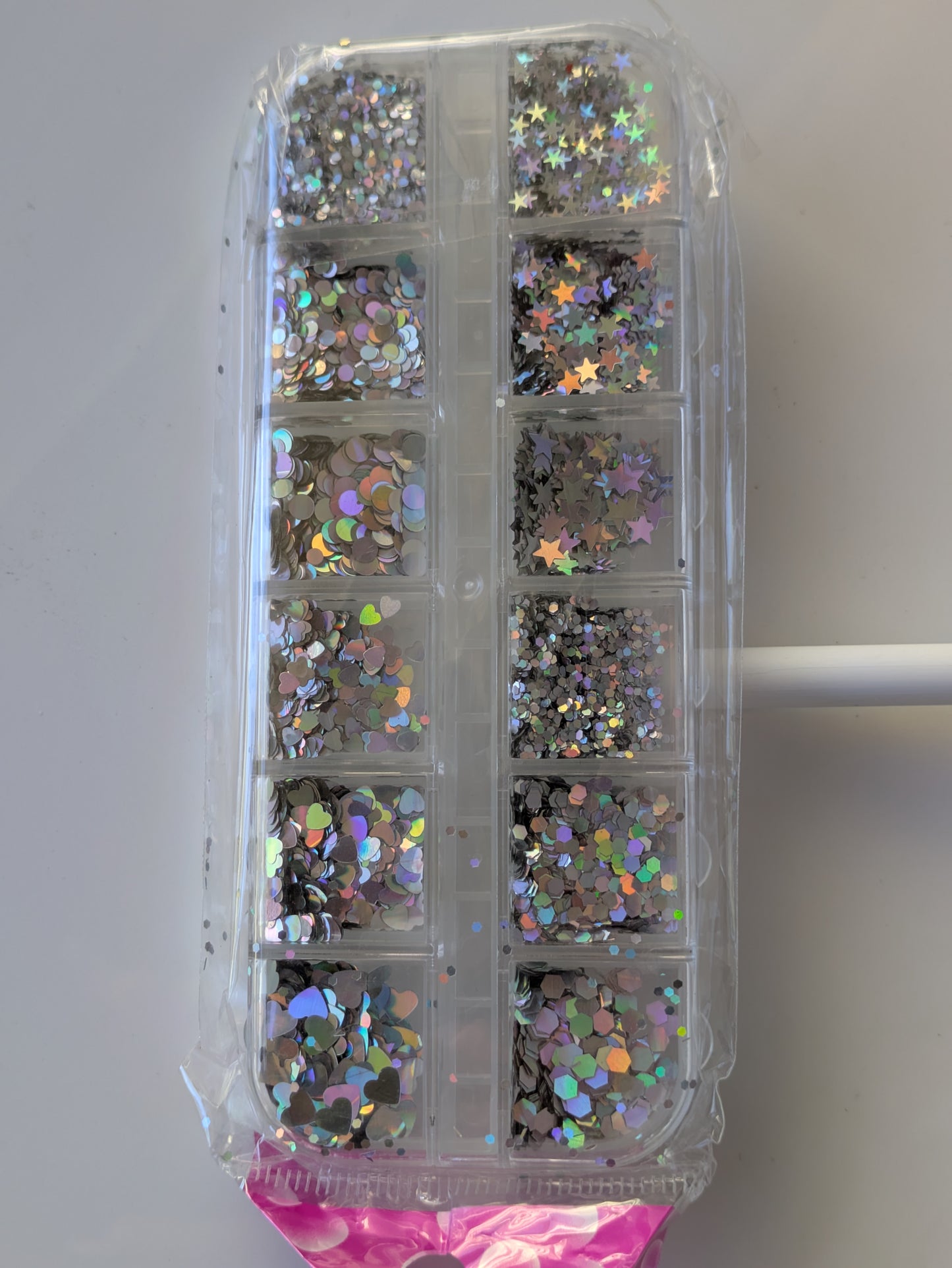 Nail art silver metallic circles, stars and hearts