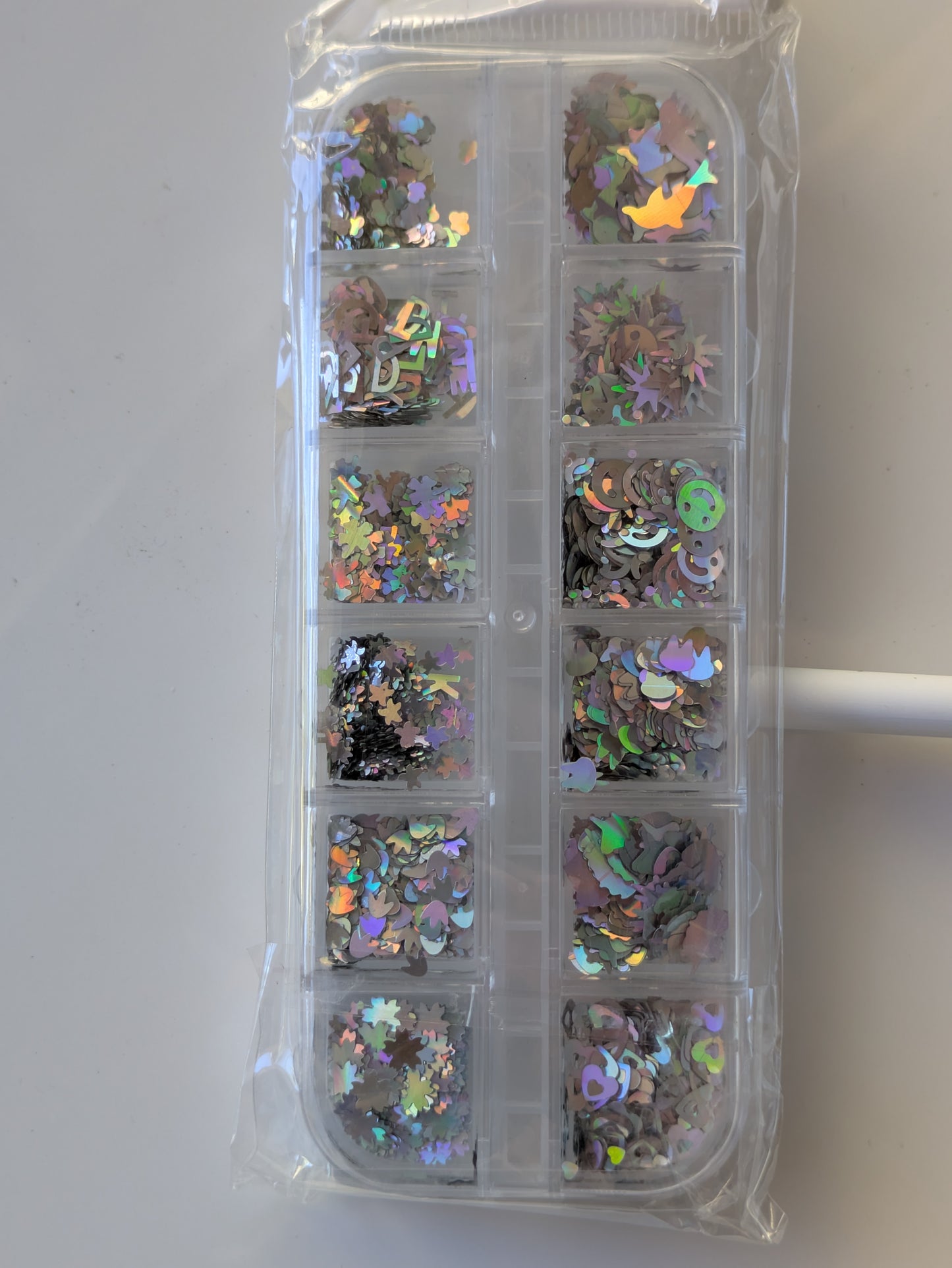 Nail art silver metallic shapes